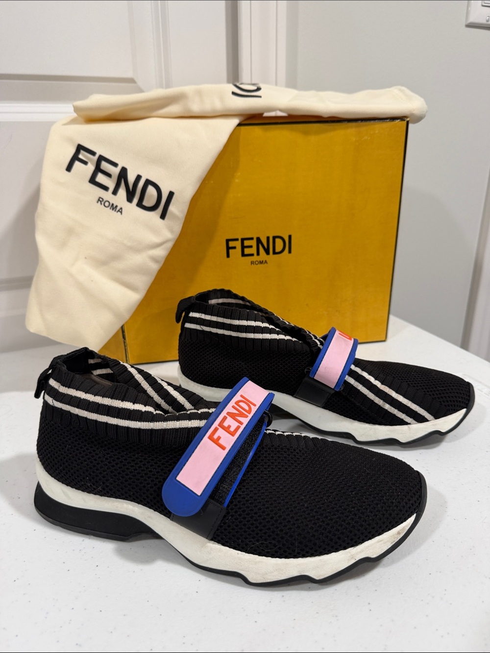Authenticated Fendi Black Knit Slip-On Sneakers with Pink and Blue Logo Strap